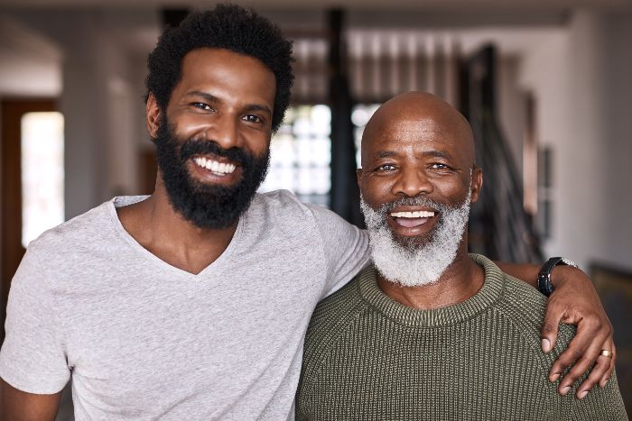 father and son smiling