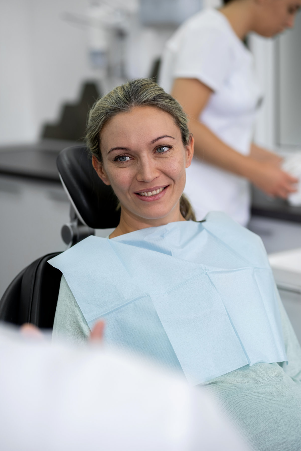 Portrait of a smiling pregnant woman at dental consultation