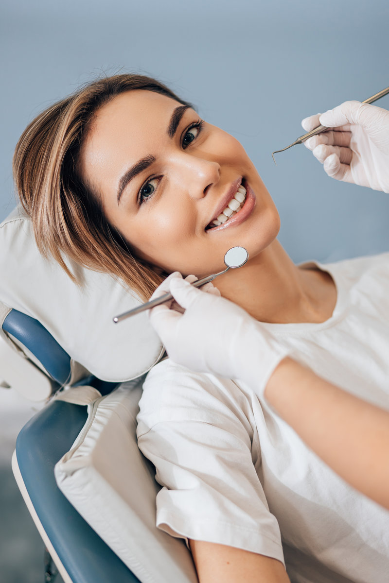 Professional doctor dentist examine and treat spoiled teeth with the use of special dental instruments, medical equipments.