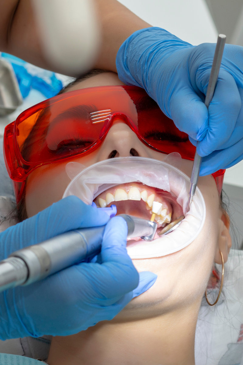 treatment of tooth decay. girl at the reception at the dentist
