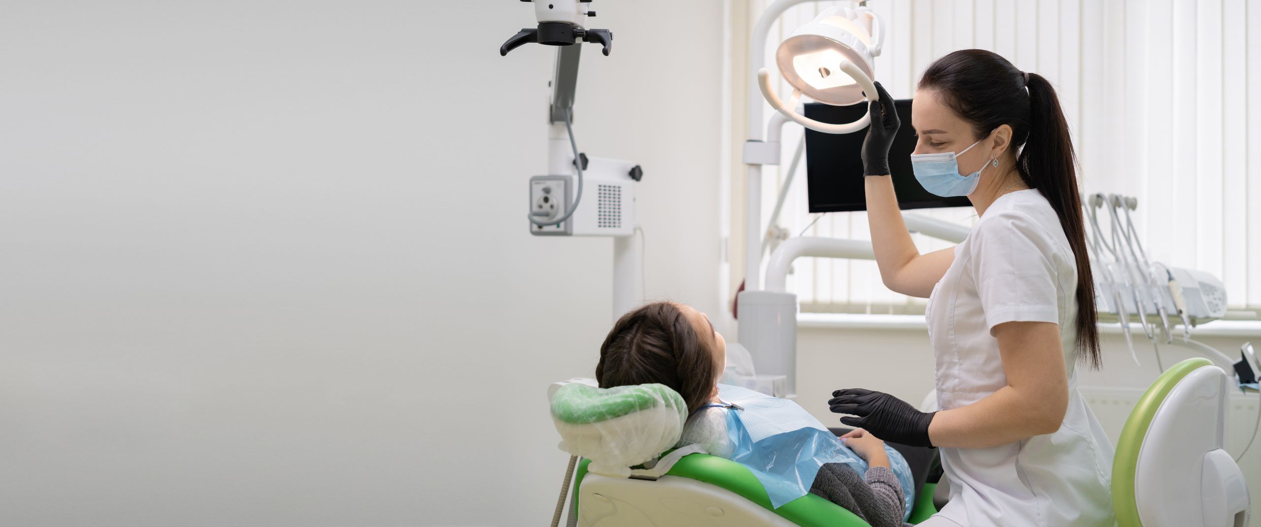 Dentist treating a patient in a modern dental office